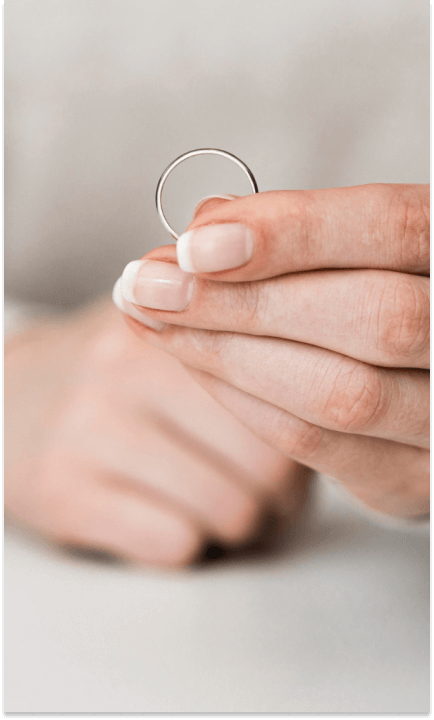Woman holding marriage ring